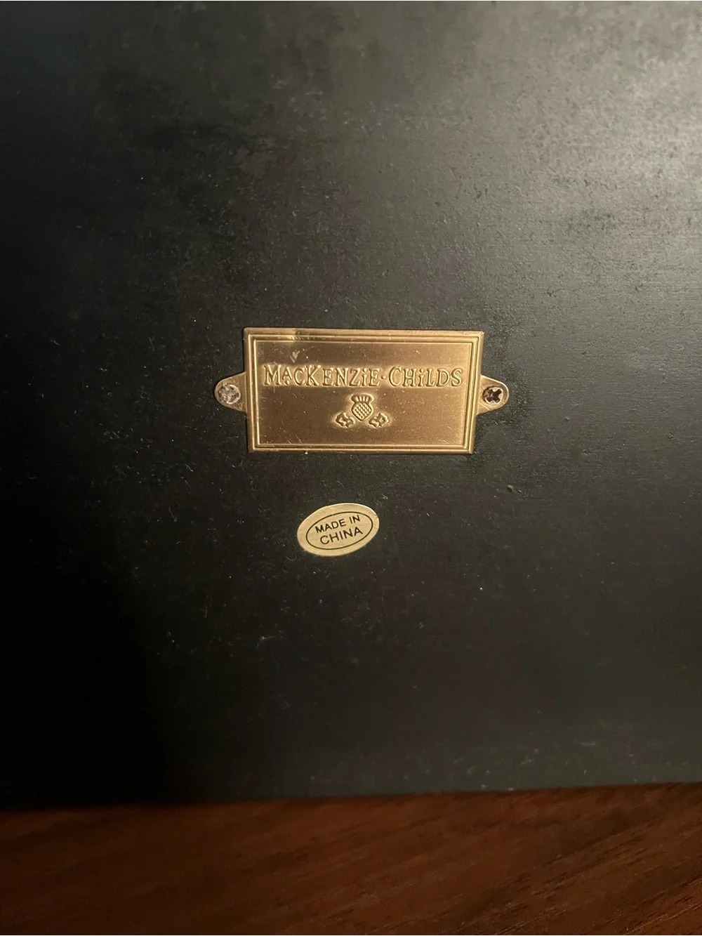 MacKenzie-Childs Gold Label Plaque on Black Surface - Picture 5 of 6